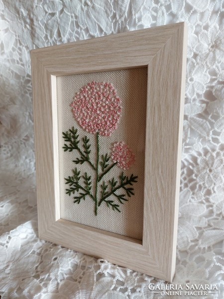 Floral embroidered image with a vintage feel.