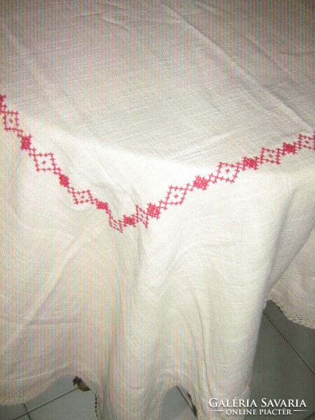 Beautiful antique hand-embroidered elegant woven tablecloth with crocheted lace on the edge