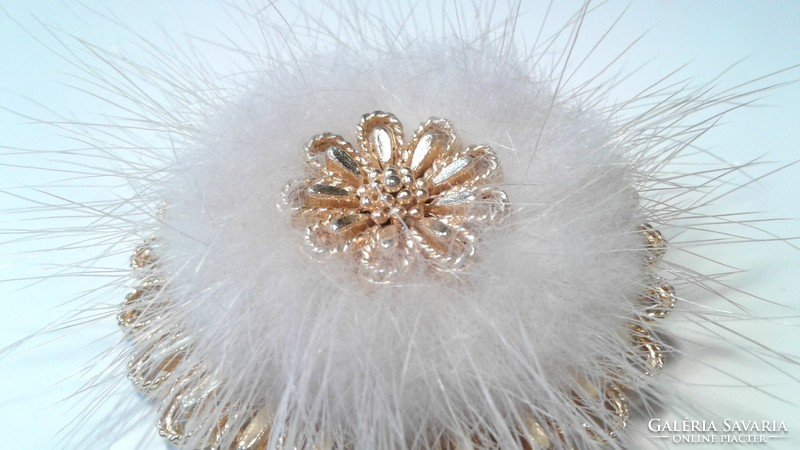 Brooch embellished with feathers