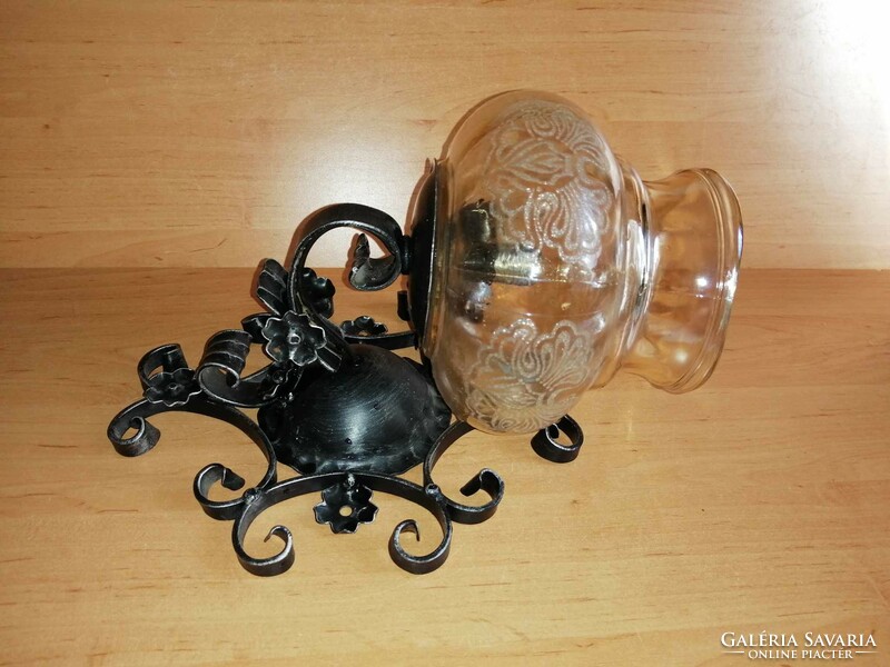 Wrought iron wall lamp with glass shade