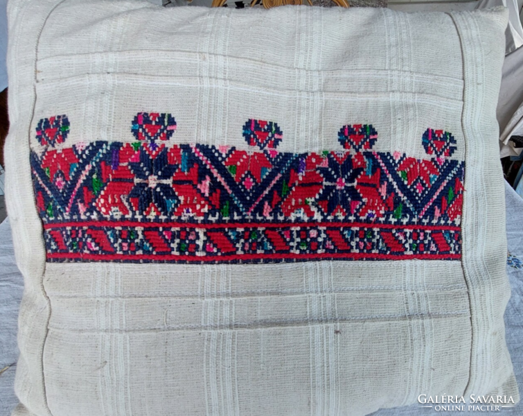 Decorative pillow decorated with cross-stitch embroidery on antique Transylvanian linen hand-woven base