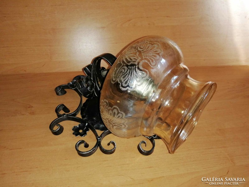 Wrought iron wall lamp with glass shade