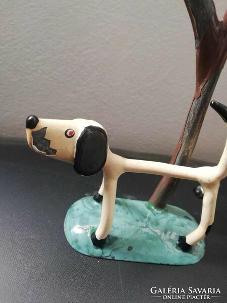 Old peeing dog metal sculpture
