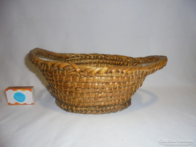 Old cane wicker basket, table offering, fruit basket