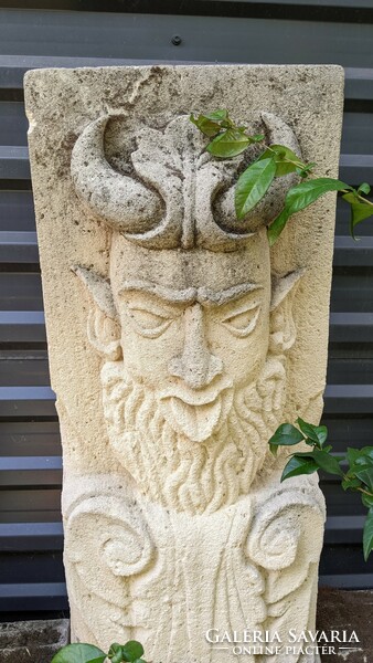 Sandstone faun head well