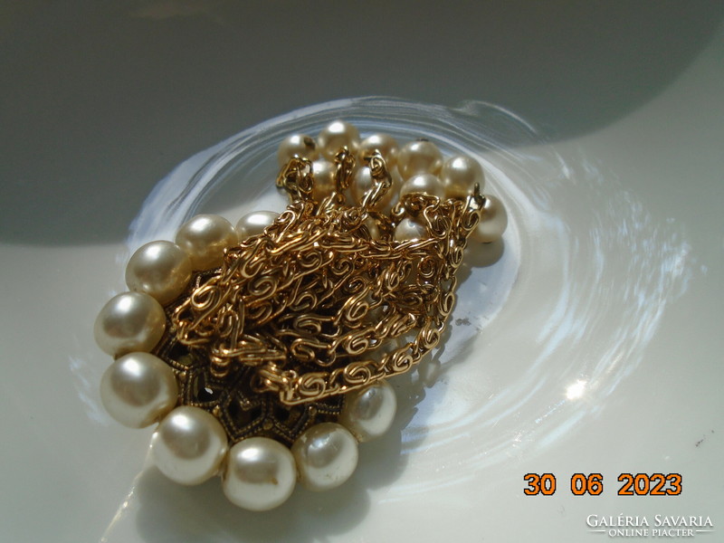 Antique filigree fire-gilded copper brooch, decorated with 11 pearls hanging on a gilded chain