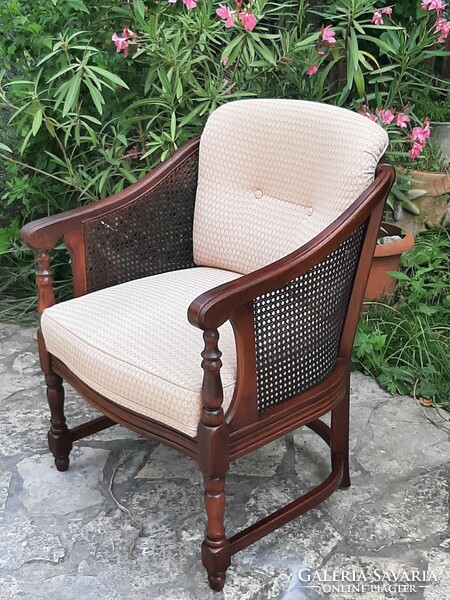 A round caned armchair in good condition