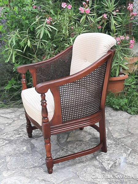 A round caned armchair in good condition