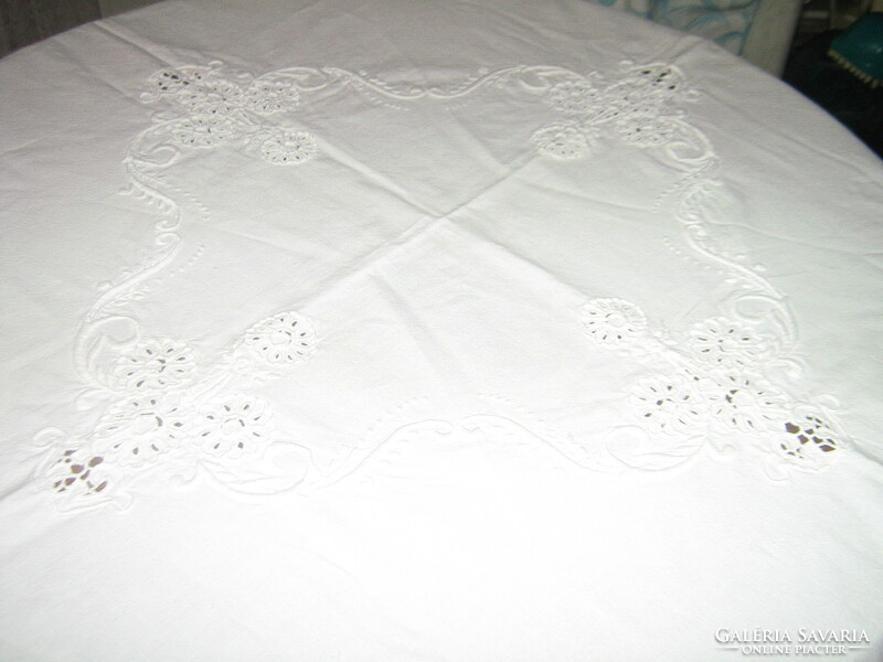 Beautiful snow-white sewn embroidered floral tablecloth