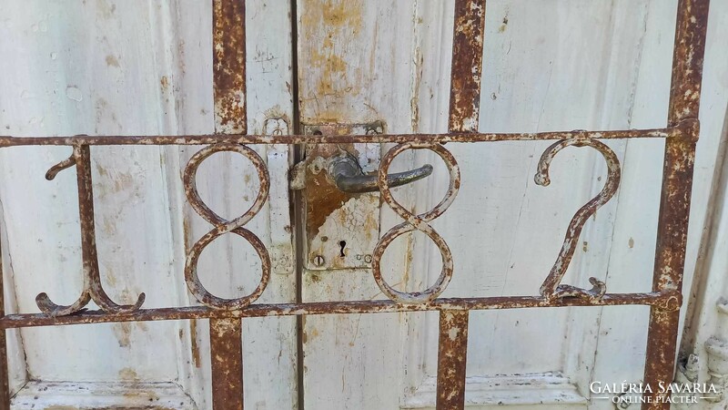 Old wrought iron window grill 1882.