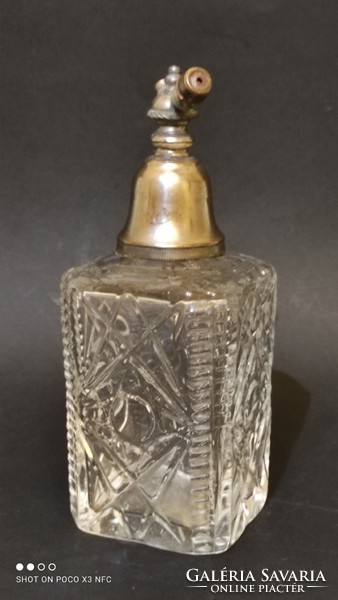 Antique perfume bottle with metal perfume highlighter