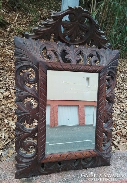 French Florentine polished mirror in an antique wooden frame
