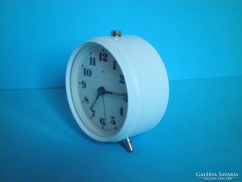 Traditional prim mechanical table rattle clock