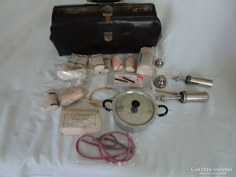 Old leather medical bag and tools.