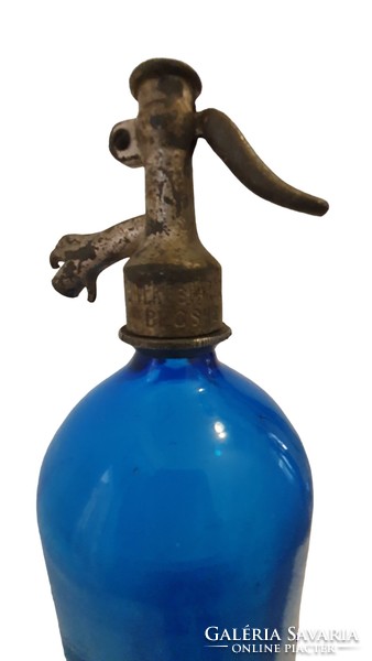 1931, blue soda bottle, with sandblasted inscription and pattern. Antique pewter head.