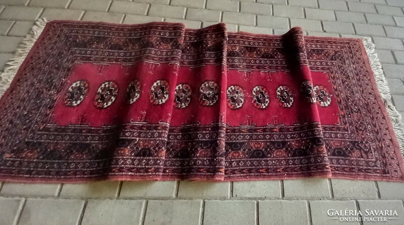 Hand-knotted bochara running rug is negotiable