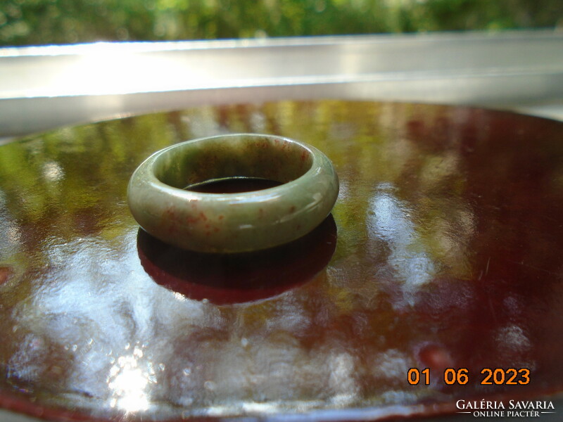 Jade ring with inclusions