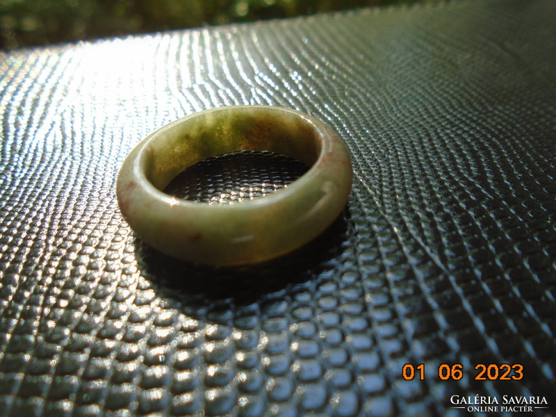 Jade ring with inclusions