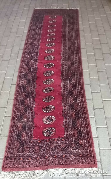 Hand-knotted bochara running rug is negotiable