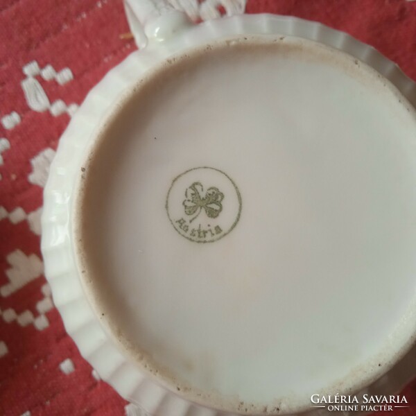 Divided porcelain teacups with gilded decor