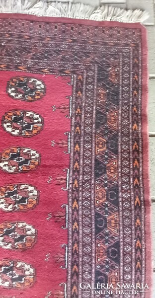 Hand-knotted bochara running rug is negotiable