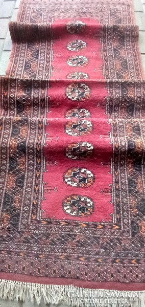 Hand-knotted bochara running rug is negotiable