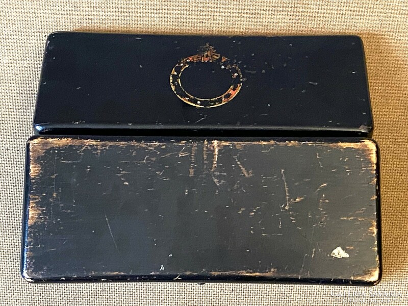 Black lacquered wooden box with worn paint