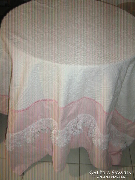 Beautiful pink jacquard pattern lace bedspread at the headboard