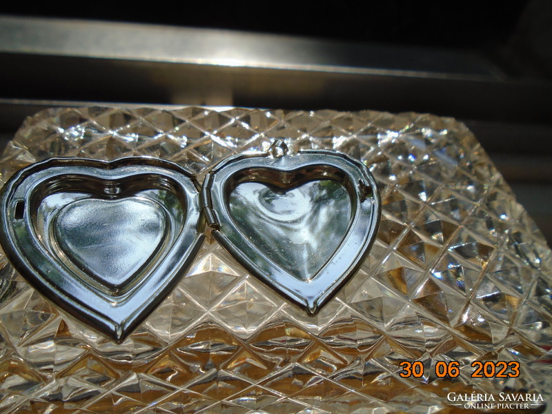 Silver-plated relic holding heart pendant with fire enamel flower