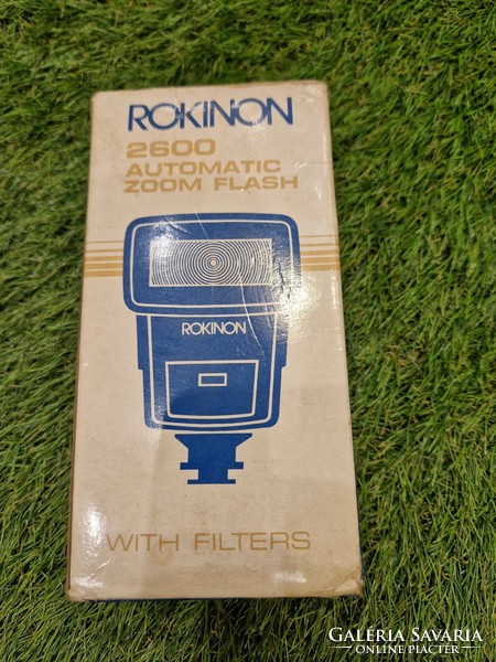 Vintage rokinon 2600 auto zoom flash with red, green, blue, transparent filters in original box.