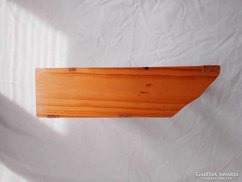 Old kitchen wooden spice shelf with folk character