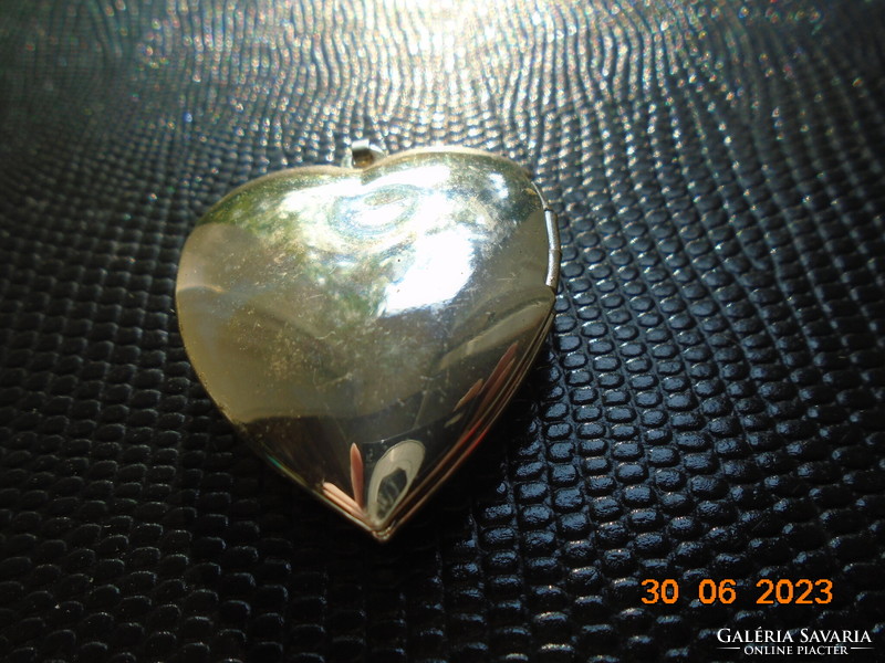 Silver-plated relic holding heart pendant with fire enamel flower