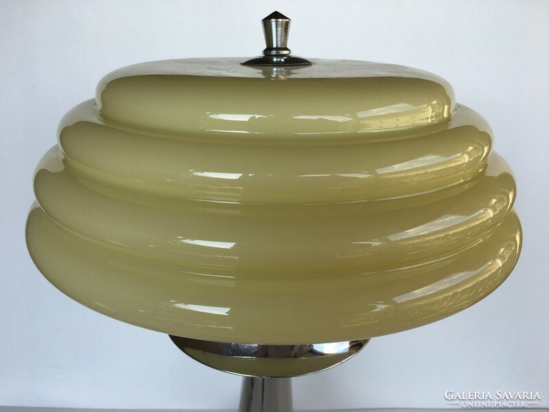 Art deco lamp with a butter colored looped cover
