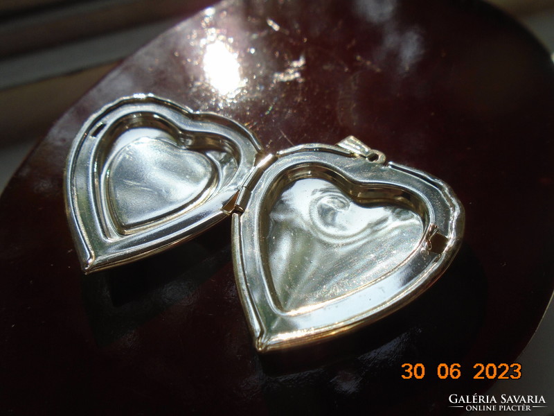 Silver-plated relic holding heart pendant with fire enamel flower