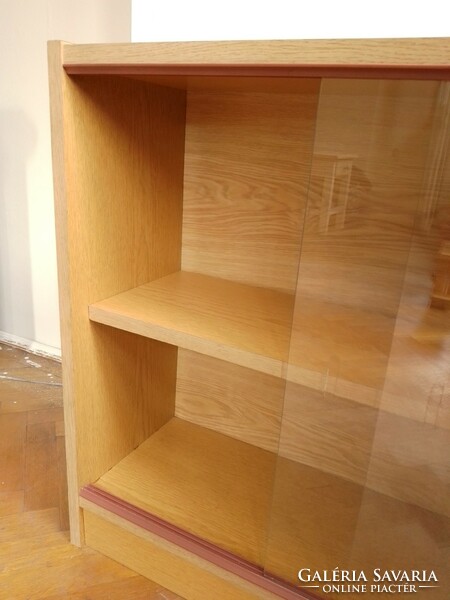 Closed bookshelf with sliding glass door, glass bookcase, low shelf storage, showcase