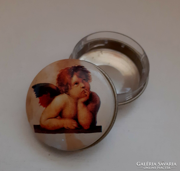 Metal medicated jewelry box with the image of an angel on it