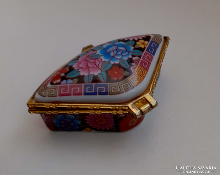 Porcelain small jewelry box in a gilded metal frame with rose flower decoration