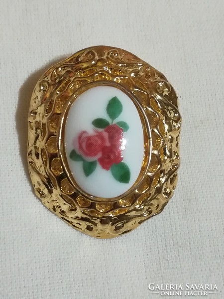 Porcelain inlaid pendant and brooch.