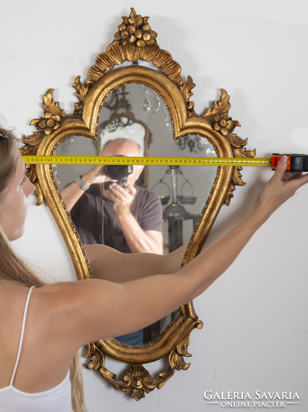 Gilded wood framed mirror with floral decor