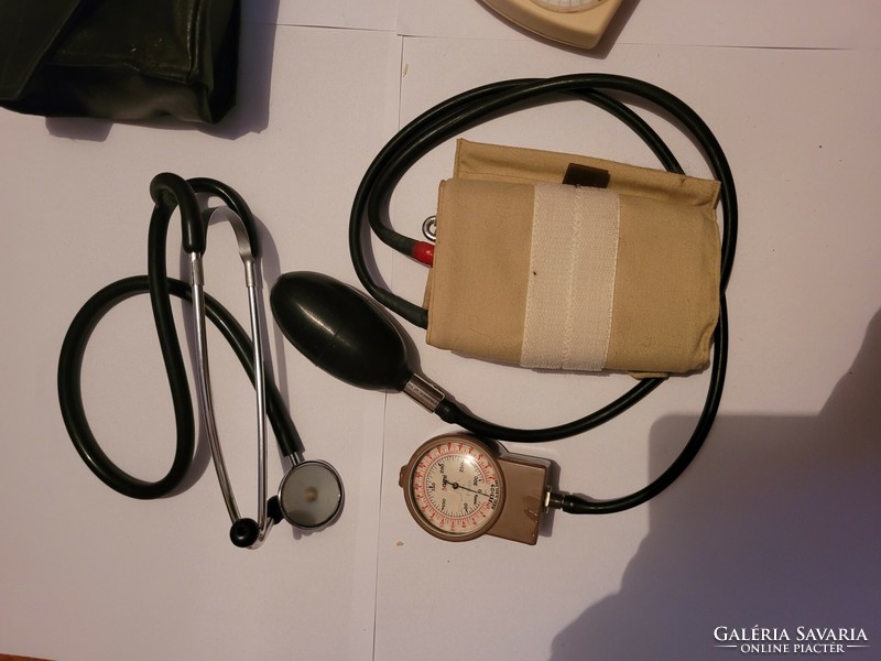2 old blood pressure monitors with stethoscopes