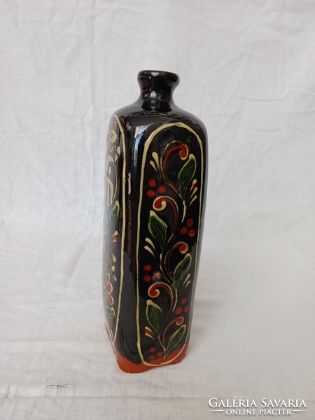 Brandy bottle decorated with market motifs