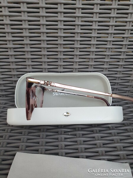 Eyeglass frame with swarovski crystals in its own case, new, unused, undamaged.