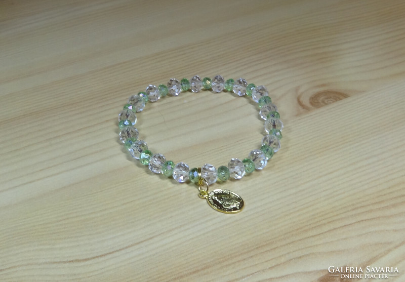 Bracelet made of crystal pearls, with Mary amulet.