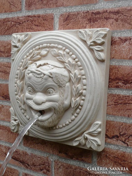 Ancient Greek gargoyle, wall fountain