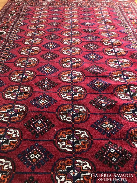 Tekke, hand-knotted, woolen Persian rug, 208x127 cm, in good condition, but slightly damaged at one end