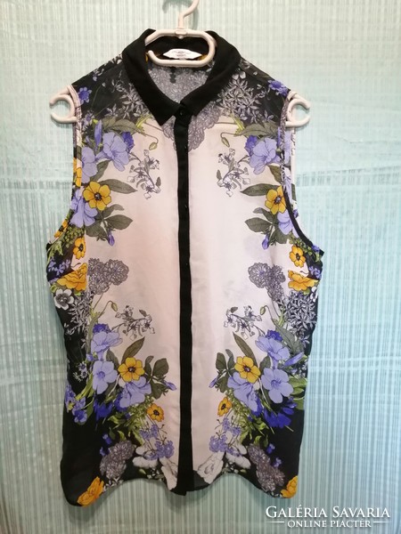 I discounted it! Colored, patterned loose women's sleeveless blouse, size 42-44, shirt.