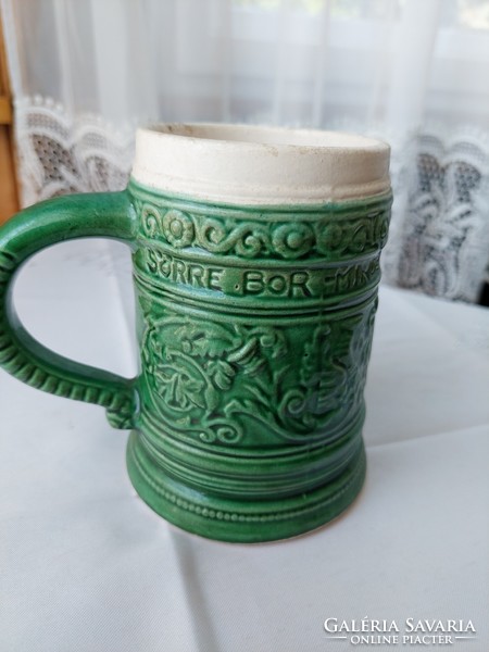 Green cup with an inscription