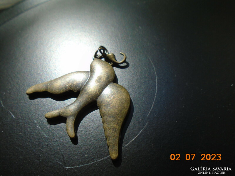 Older copper or bronze casting bird pendant