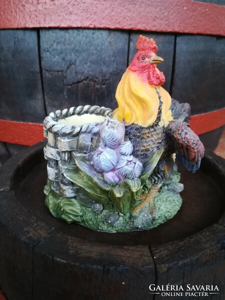A proud rooster with a bucket of water, which is also a holder.