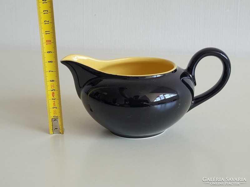 Glazed ceramic pouring black yellow small jug